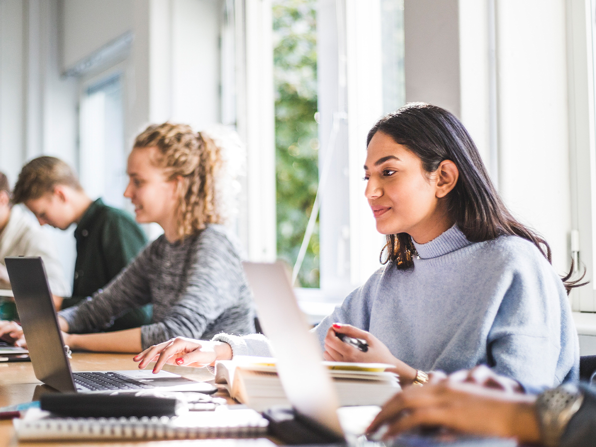 Students learning on laptops.