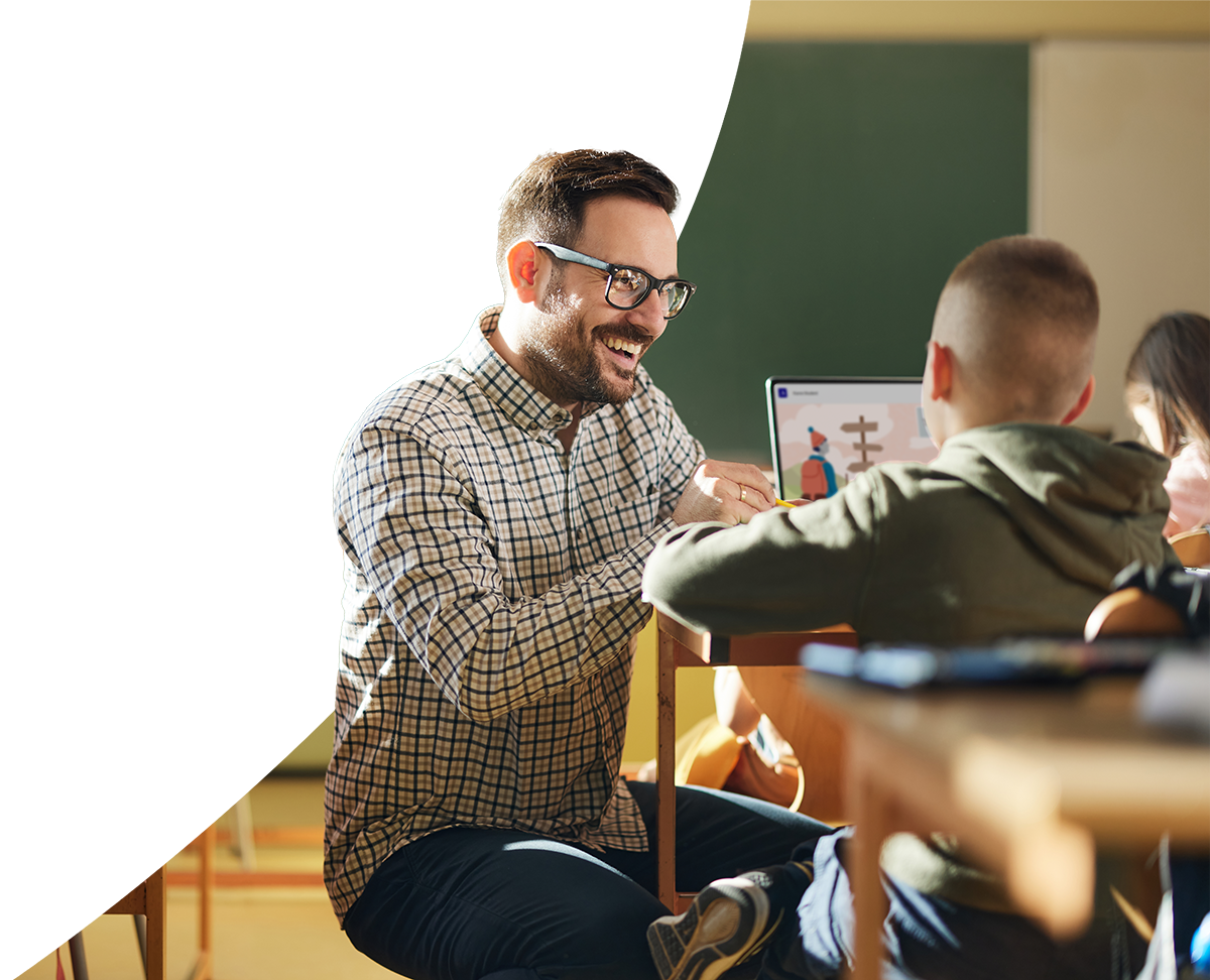 Educator guiding students through digital assessments on a laptop.